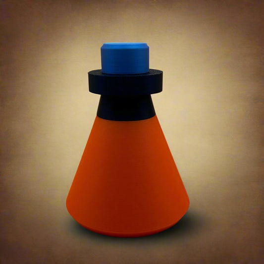 A three piece Stash Potion container with a blue lid on top, a black band in the middle, and an orange cone-shaped base.